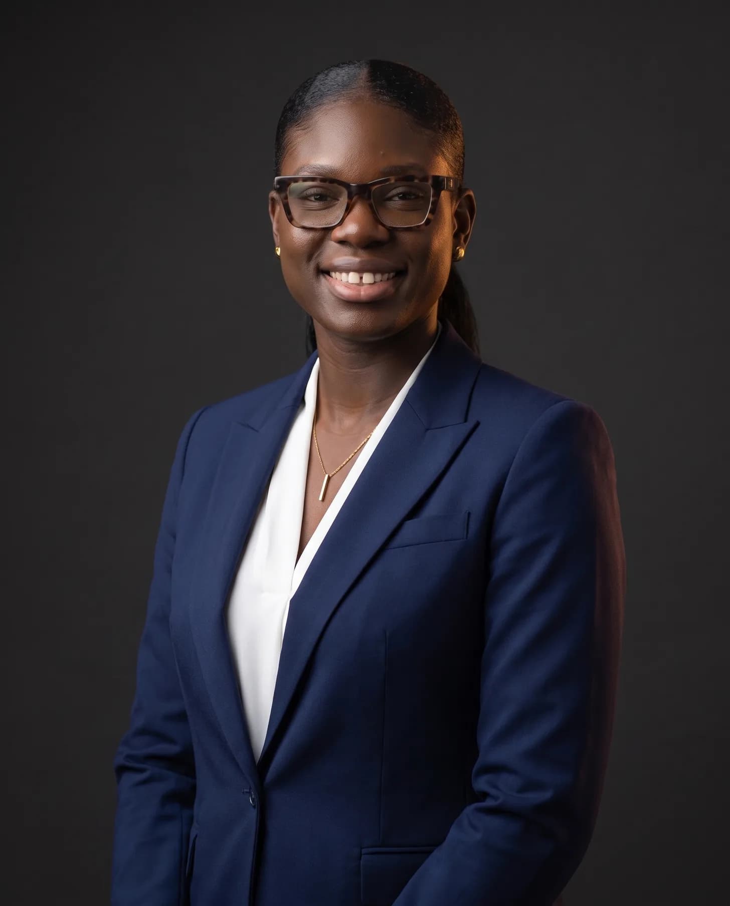 Shivonne Okoye, Dental Brand Strategist and founder of PROPHY, standing in a navy suit